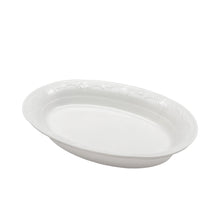 white oval dish with patterned edge