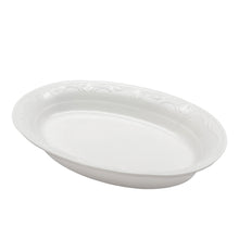white oval dish with patterned edge