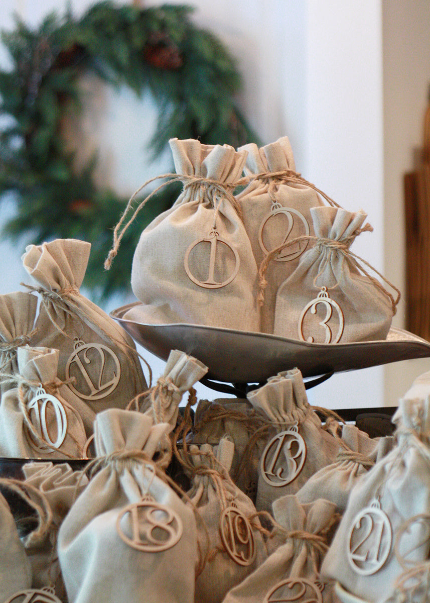 stack of canvas bags with numbered tags