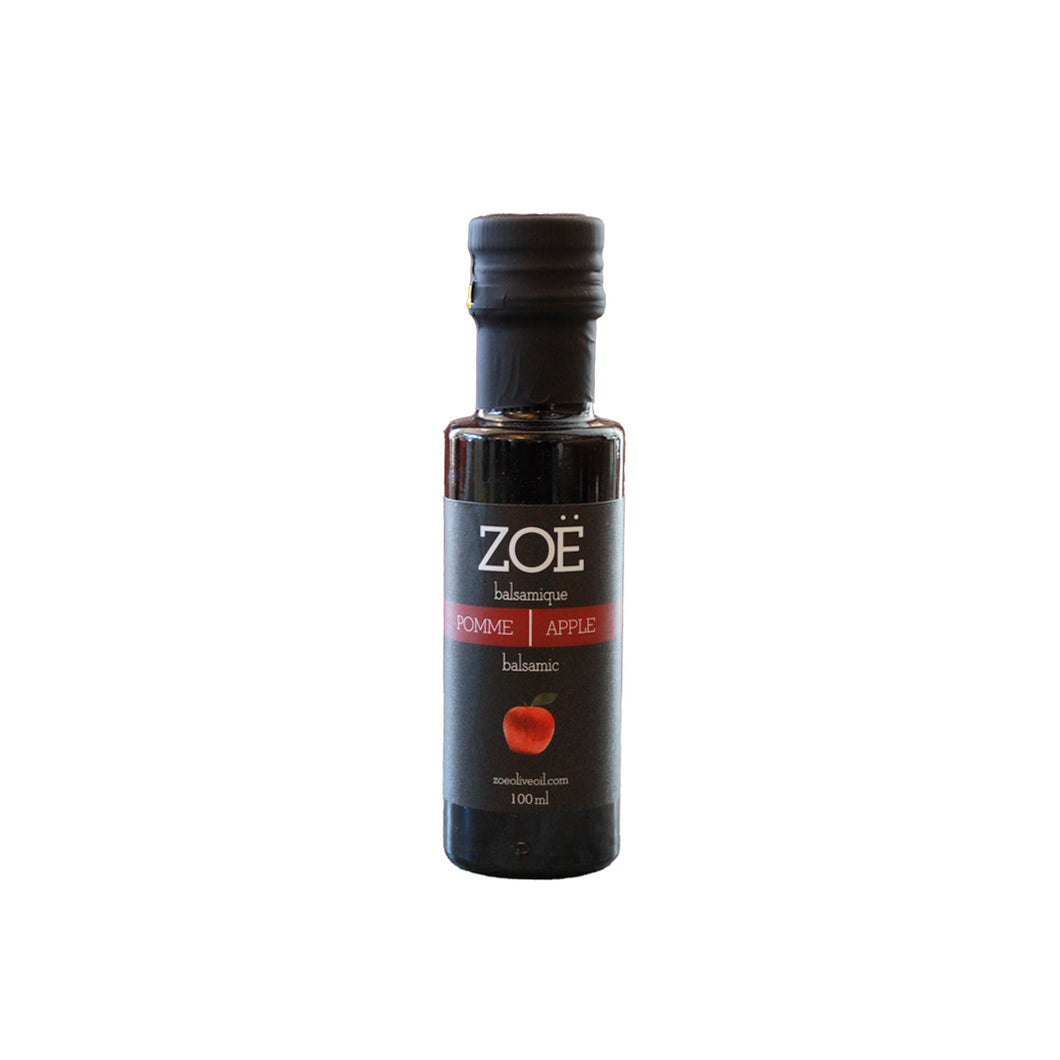 Bottle of Zoe apple balsamic vinegar on a white background