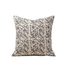 Blue floral patterned decorative pillow on a white background