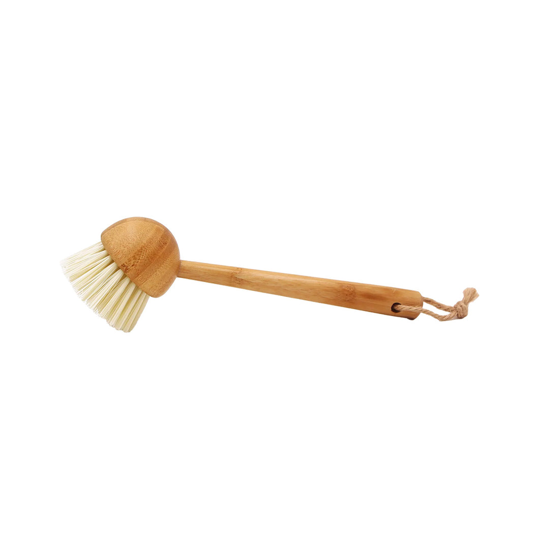 Bamboo dish brush with bristle head on a white background