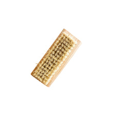 Bamboo nail brush with natural bristles on a white background