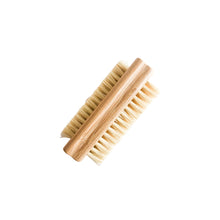 Bamboo nail brush with natural bristles on a white background
