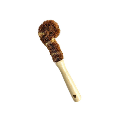 Glass dish brush with bamboo handle and coconut bristle head on a white background