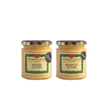 Two jars of Thursday Cottage Butter with decorative labels on a white background