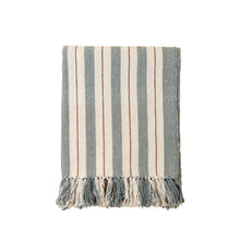 Striped blue and cream cotton blanket with tassels on a white background