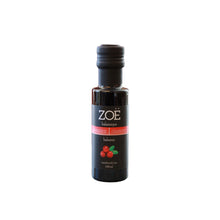 Bottle of Zoe cranberry balsamic vinegar on a white background