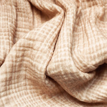Close-up of blush/beige crinkle fabric
