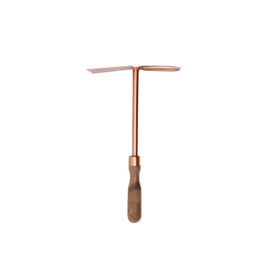 copper cultivator and hoe combo on a wooden handle