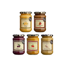 Five jars of Thursday Cottage Curd on a white background