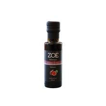 Bottle of Zoe fig balsamic vinegar on a white background