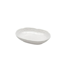 white oval dish with patterned edge