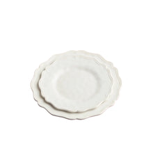 cream melamine dinner plate and salad plate stacked with detailed edges