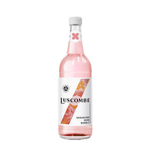 Pink bottle of Luscombe Damascene Rose Bubbly on a white background