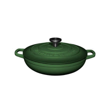 Green cast iron cookware braiser pot with lid on a white background