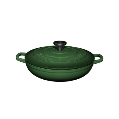 Green cast iron cookware braiser pot with lid on a white background