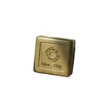 A single square bar of olive soap, embossed with the brand 'Maison des Chantiers' and 'Olive - 150g'.