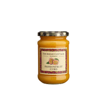 jar of thursday cottage passionfruit curd on a white background