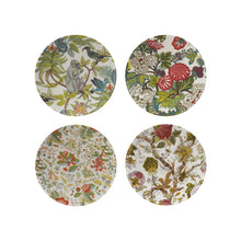 four patterned botanical stoneware printed plates on a white background