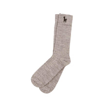 Pair of beige alpaca socks with a small Pokoloko  logo on a white background