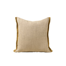 Beige linen pillow with mustard colour trim on a white background