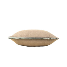 Beige linen pillow with mustard robins egg blue trim on its side on a white background