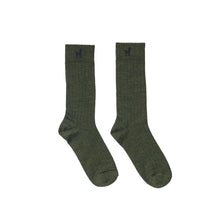 Pair of green alpaca socks with a small Pokoloko  logo on a white background