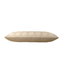 Beige decorative pillow with sun pattern on a white background from the side