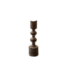 mid height brown candle holder on a white background