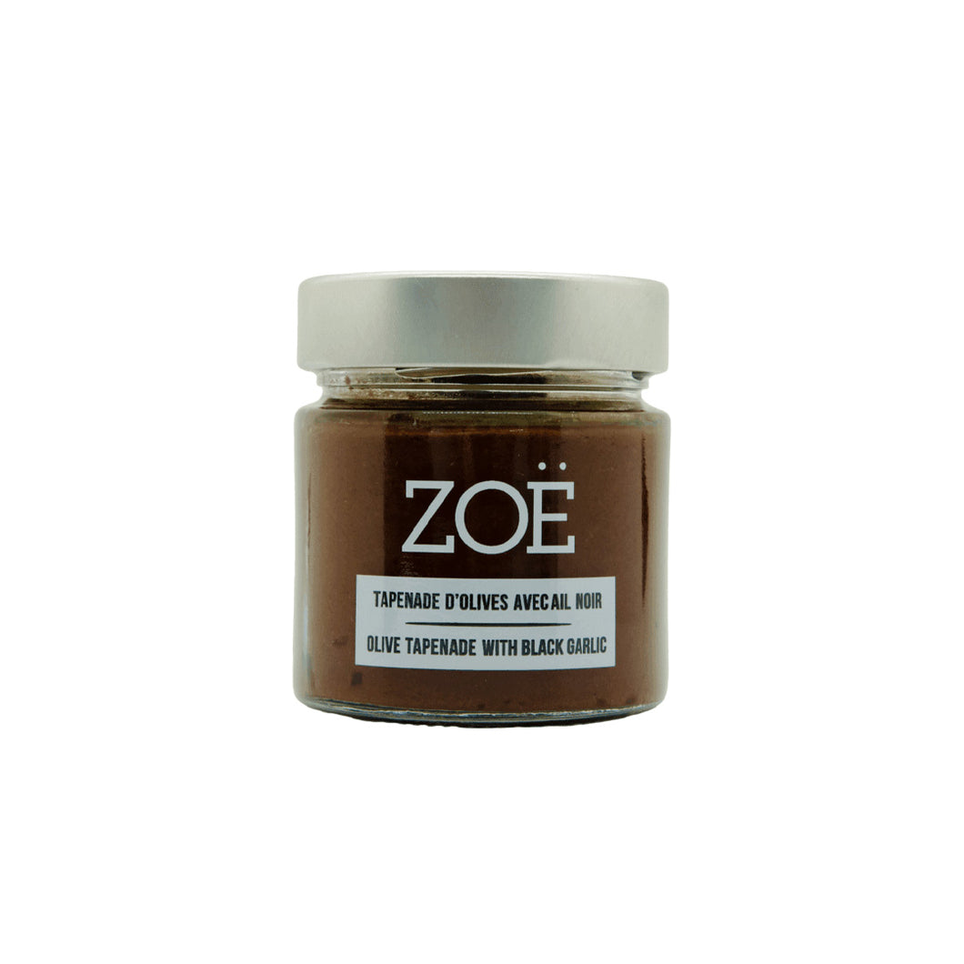 Jar of Zoe olive tapenade with black garlic on a white background