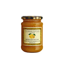 Jar of Thursday Cottage Reduced Sugar Three Fruits Marmalade on a white background