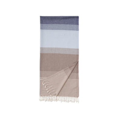 Color-blocked towel with stripes in blue, grey, and beige with tassels on a white background