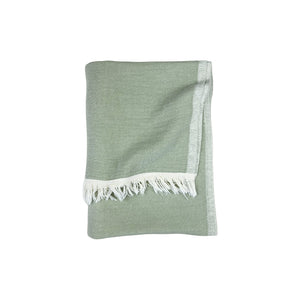 green towel with cream tassles