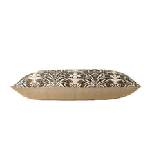 Decorative pillow with a floral pattern from the side on a white background