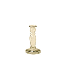 Clear glass candlestick holder size small on a white background