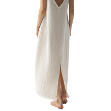 Cream strappy crinkle dress with frayed edges from the back 