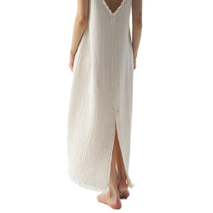 Cream strappy crinkle dress with frayed edges from the back 